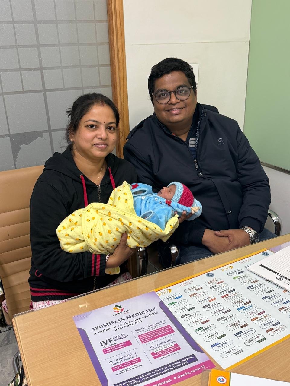 New parents with their baby at the clinic