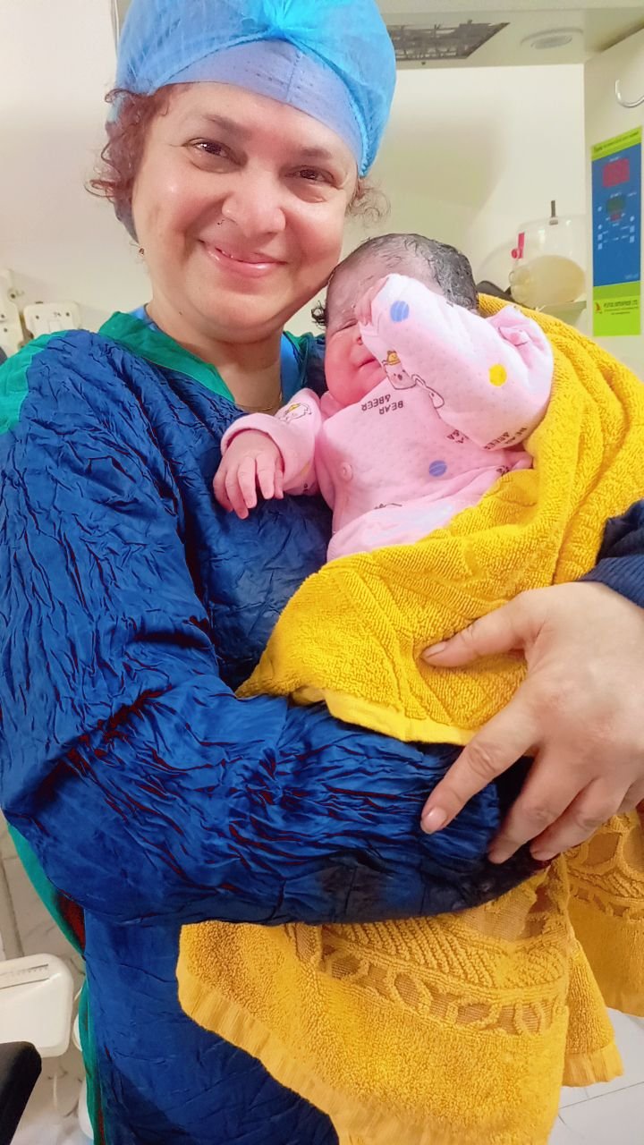 Nurse holding a newborn baby